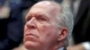 FILE - CIA Director John Brennan listens to remarks by President Barack Obama at the Director of National Intelligence Office to mark its 10th anniversary, in McLean, Virginia, April 24, 2015.