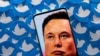 FILE PHOTO: Illustration shows Elon Musk image on smartphone and printed Twitter logos