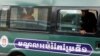 Uon Chhin and Yeang Sothearin, former journalists of the Radio Free Asia (RFA), sit inside a police vehicle as they arrive for a bail hearing at the Appeal Court in Phnom Penh, Cambodia, April 19, 2018. REUTERS/Samrang Pring