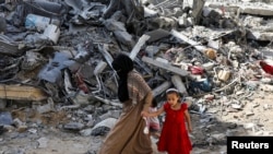 Aftermath of Israeli strikes at the area where Israeli hostages were rescued on Saturday, in Nuseirat refugee camp
