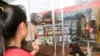FILE: Kem Ley body laid down inside the mart. Kem Ley, a​ Cambodian political analyst was shot death on Sunday, July 10, 2016 at a gas station in Phnom Penh. ( Leng Len/VOA Khmer)