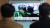 People watch a TV screen showing a local news program reporting about North Korea's missile launch, at the Seoul Railway Station in Seoul, South Korea, Nov. 30, 2017. 