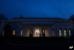 A Marine stands outside the West Wing of the White House in Washington. (AP Photo/Evan Vucci)