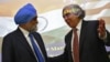 U.S. Energy Secretary Ernest Moniz (R) gestures to Deputy Chairman of India's Planning Commission Montek Singh Ahluwalia after their joint news conference in New Delhi, March 11, 2014. 