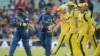 Sri Lanka's Mahela Jayawardena (2nd L) speaks to Australia's Clint McKay as the players leave the field after the Sri Lanka innings during the ICC Champions Trophy group A match at The Oval cricket ground, London, June 17, 2013. 