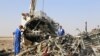 Russian emergency services personnel working at the crash site of a A321 Russian airliner in Wadi al-Zolomat, a mountainous area of Egypt's Sinai Peninsula. (Russian Emergency Ministry Handout photo)