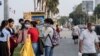 FILE: People with mask on are walking in the park in front of the Royal Palace in Phnom Penh, Cambodia, February 11th, 2020. (Malis Tum/VOA Khmer) 
