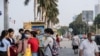 People are walking in the park in front of the Royal Palace in Phnom Penh, Cambodia on 11th February, 2020. (Malis Tum/VOA Khmer)