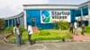 FILE - Employees stand outside the Start-up Village in Kinfra High Tech Park in the southern Indian city of Kochi.