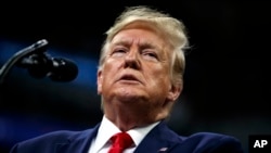FILE - President Donald Trump speaks at a campaign rally at the Target Center in Minneapolis, Minnesota, Oct. 10, 2019.