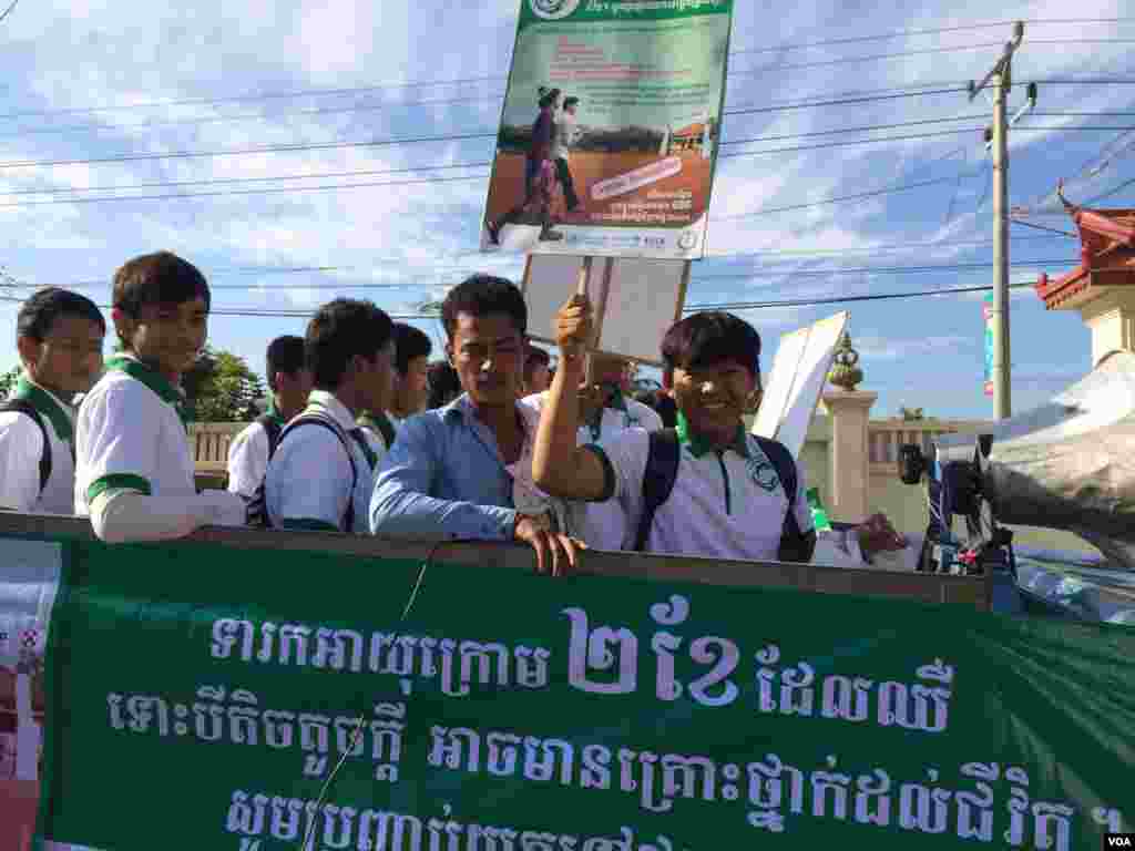 Cambodian students traveling on trucks are ready to campaign for better healthcare for children and newborns in Kampong Speu province.