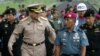 Chief of Thai Defense Force Gen. Thanasak Patimaprakorn, left, walks with Indonesian Marine Chief of Staff Brig. Gen Achmad Faridz during his visit at the marine headquarters in Jakarta, Indonesia, July 18, 2012.