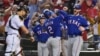 Texas Rangers shortstop Geraldo Perdomo (2) celebrates with left fielder Tommy Pham (28) after scoring a run in the ninth inning against the Arizona Diamondbacks. The Rangers won the 2023 World Series in five games. Matt Kartozian/USA TODAY Sports.