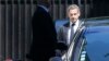 Former French President Nicolas Sarkozy (R) leaves his residence in Paris, July 2, 2014.