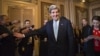 Sen. John Kerry, D-Mass., emerges after a unanimous vote by the Senate Foreign Relations Committee approving him to become America's next top diplomat, replacing Secretary of State Hillary Rodham Clinton, on Capitol Hill in Washington, January 29, 2013.