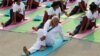 India's Prime Minister Narendra Modi participates in a yoga session to mark International Day of Yoga, in New Delhi, India, June 21, 2015. Modi led tens of thousands of people in the yoga session in the centre of the capital on Sunday to showcase the country's signature cultural export, which has prompted criticism of fomenting social divisions at home. 