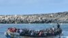 FILE — Migrants arrive on a boat at La Restinga dock in the municipality of El Pinar on the Canary Island of El Hierro, Oct. 21, 2023. The number of people arriving in Spain's Canary Islands so far this year has neared a record.