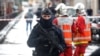 A police officer stands guard at the scene of an incident near the former offices of French magazine Charlie Hebdo, in Paris, Sept. 25, 2020.