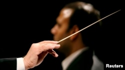 FILE - A conductor conducts an orchestra, Jan. 3, 2007. Under the leadership — and baton — of artistic director Victor DeRenzi, the Sarasota Opera will have put on Giuseppe Verdi's "La Battaglia di Legnano" ("The Battle of Legnano"), a fully staged production of every opera written by the prolific Italian composer, including the many revisions he made over his lifespan of 87 years.