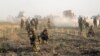 FILE - Kurdish Peshmerga troops deploy during a military operation to regain control of some villages from Islamic State group fighters south of oil-rich city of Kirkuk, 180 miles (290 kilometers) north of Baghdad, Iraq, Aug. 26, 2015.