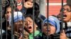 FILE - Indian Christians shout slogans protesting attacks on churches in the Indian capital as they assemble outside the Sacred Heart Church in New Delhi, India, Feb. 5, 2015.