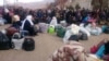Syrians wait for the arrival of an aid convoy, Jan. 11, 2016, in the besieged town of Madaya as part of a landmark six-month deal reached in September for an end to hostilities in those areas in exchange for humanitarian assistance.