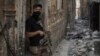 An Iraqi Special Forces soldier stands in a Mosul alley, July 7, 2017.