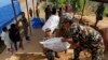 Nepalese soldiers load USAID relief sacks at a staging area near Saturday's massive earthquake's epicenter in the town of Gorkha, Nepal, April 28, 2015. 