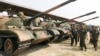 FILE PHOTO - Cambodia's Deputy Prime Minister and Defence Minister Tea Banh (2nd R) inspect tanks inside the Army Institute after a graduation ceremony at Army Institute in Kampong Speu province on March 12, 2015. (REUTERS/Samrang Pring)