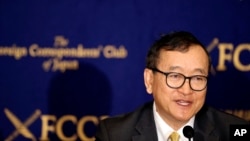 Cambodia's self-exiled opposition leader Sam Rainsy speaks during a press conference in Tokyo, Friday, April 13, 2018. Rainsy urged Japan, his nation's biggest donor, to use its leverage and convince the autocratic government to make sure that the July election is democratic. (AP Photo/Koji Sasahara)