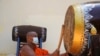 Cambodia pagodas use traditional drums and gongs to send alert on COVID-19