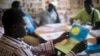 FILE - Patients undergoing a rehabilitation program draw during a therapy session at the Sopi Jikko centre in Dakar, June 6, 2014. Sopi Jikko is a rehabilitation center for people with mental health and drug addiction problems.