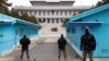 South Korean soldiers stand guard during a media tour at the Joint Security Area (JSA) on the Demilitarized Zone in the border village of Panmunjom in Paju, South Korea, March 3, 2023. 