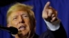 FILE PHOTO: Former U.S. President and Republican presidential candidate Donald Trump attends a campaign event in Manchester,