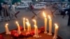 FILE - Lighted candles are seen outside a mosque of the Ahmadi sect, in Lahore, Pakistan, May 30, 2010. Unknown gunmen in central Pakistan on Thursday killed Malik Saleem Latif, a local leader of the Ahmadi community, considered the country’s most persecuted religious sect.