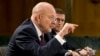 Director of National Intelligence James Clapper (l) accompanied by DIA Director Lt. Gen. Michael T. Flynn, testifies on Capitol Hill, April 18, 2013.