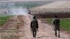 FILE - Turkish soldiers patrol near the border with Syria in southeastern Turkey, July 24, 2015.