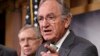 Senator Tom Harkin, sponsor of the Minimum Wage Fairness Act (R), joined by Senate Majority Leader Harry Reid, comments to reporters after the bill to raise the minimum wage to $10.10 was stopped in the Senate, during a news conference on Capitol Hill in 