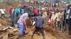 Rescue workers and people search for bodies after landslides following heavy rains buried 40 homes in the mountainous district of Bulambuli, eastern Uganda, Nov. 28. 2024.