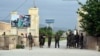 Afghan soldiers stand guard at the gate of a military compound after an attack by gunmen in Mazar-i-Sharif province north of Kabul, Afghanistan, April 21, 2017. Gunmen wearing army uniforms stormed a military compound in the Balkh province, an Afghan government official said Friday.