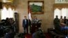 The spokesman of the Shi'ite rebels known as Houthis, Mohammed Abdel Salam, center, speaks at a press conference prior to the departure of the Houthi delegation for the Geneva peace talks, in Sana'a, Yemen, Dec. 12, 2015. 